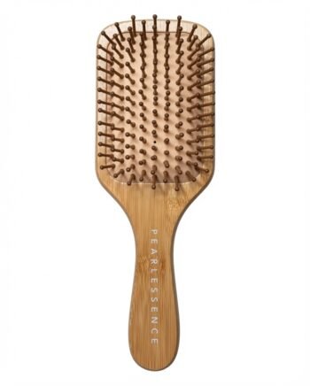 Wooden paddle hairbrush with dense brown bristles and a Pearlessence handle used for grooming hair.